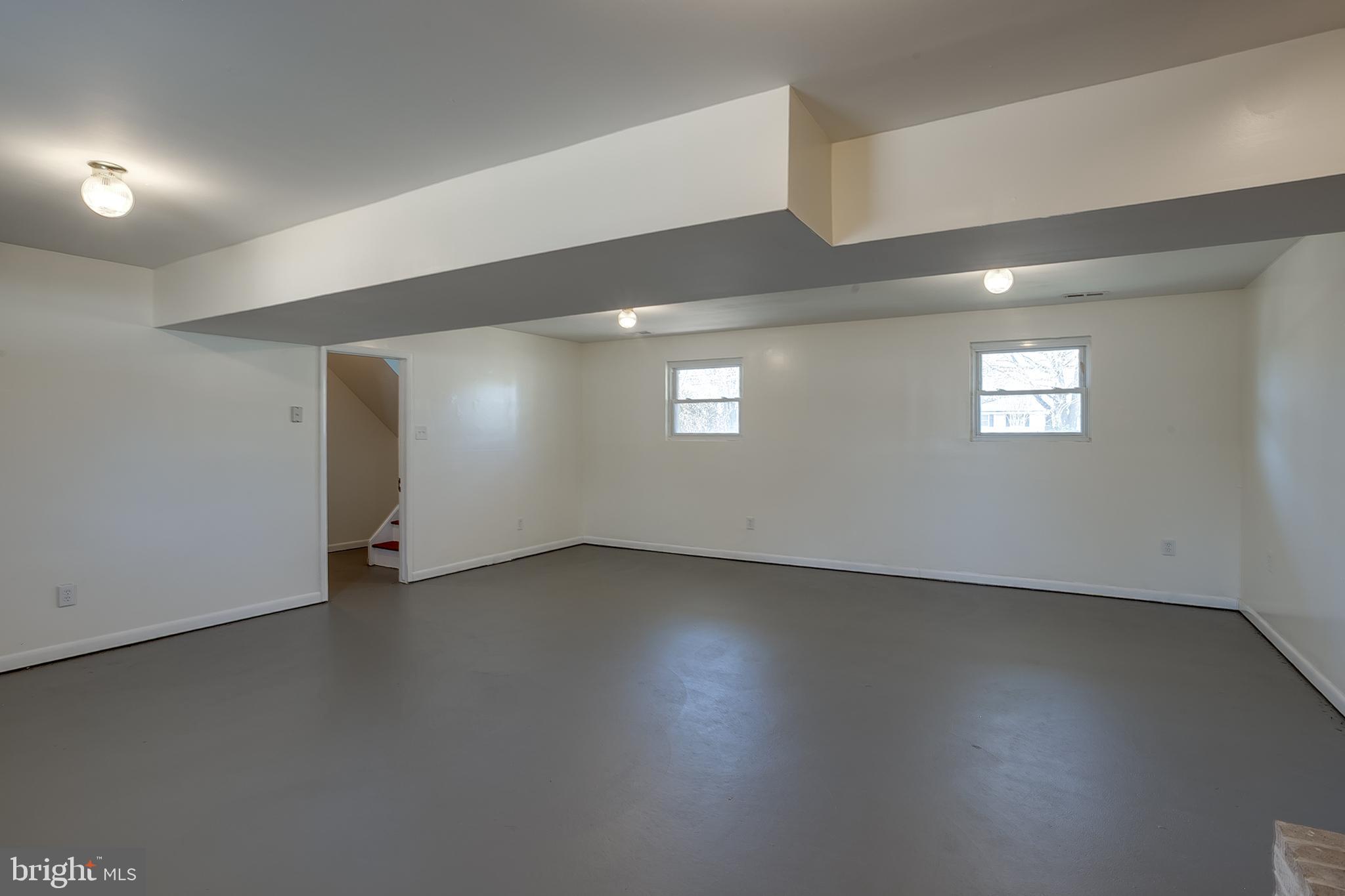2430 Hopewell Road Berlin, NJ 08009 - Photo 18 of 30 an empty room with wooden floor and windows