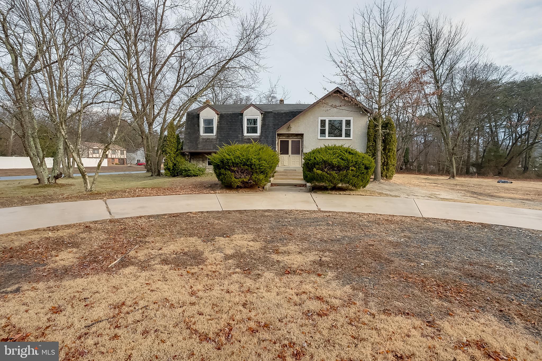 2430 Hopewell Road Berlin, NJ 08009 - Photo 2 of 30 a front view of a house with a yard covered in snow