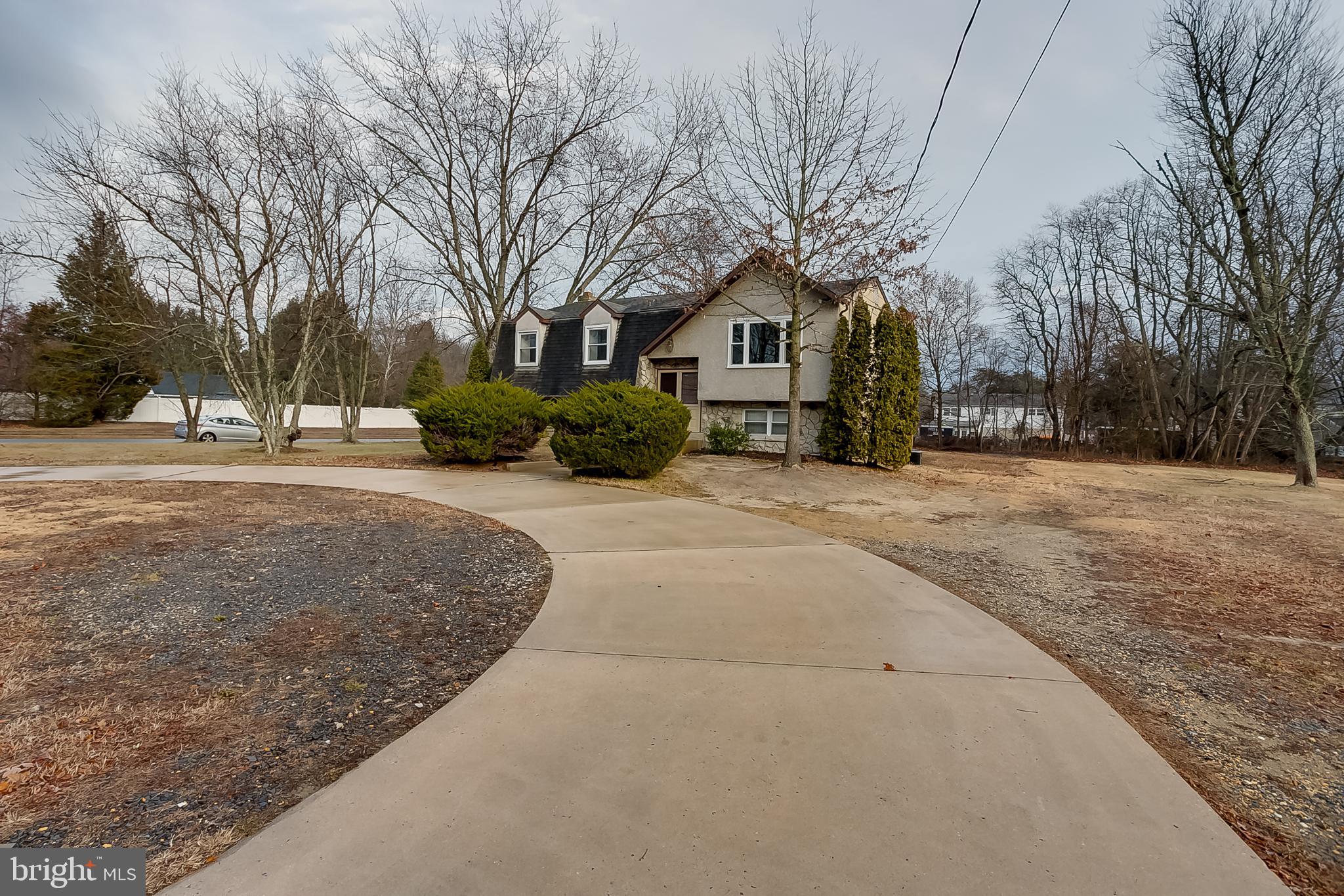 2430 Hopewell Road Berlin, NJ 08009 - Photo 3 of 30 a view of a house with a yard covered in snow