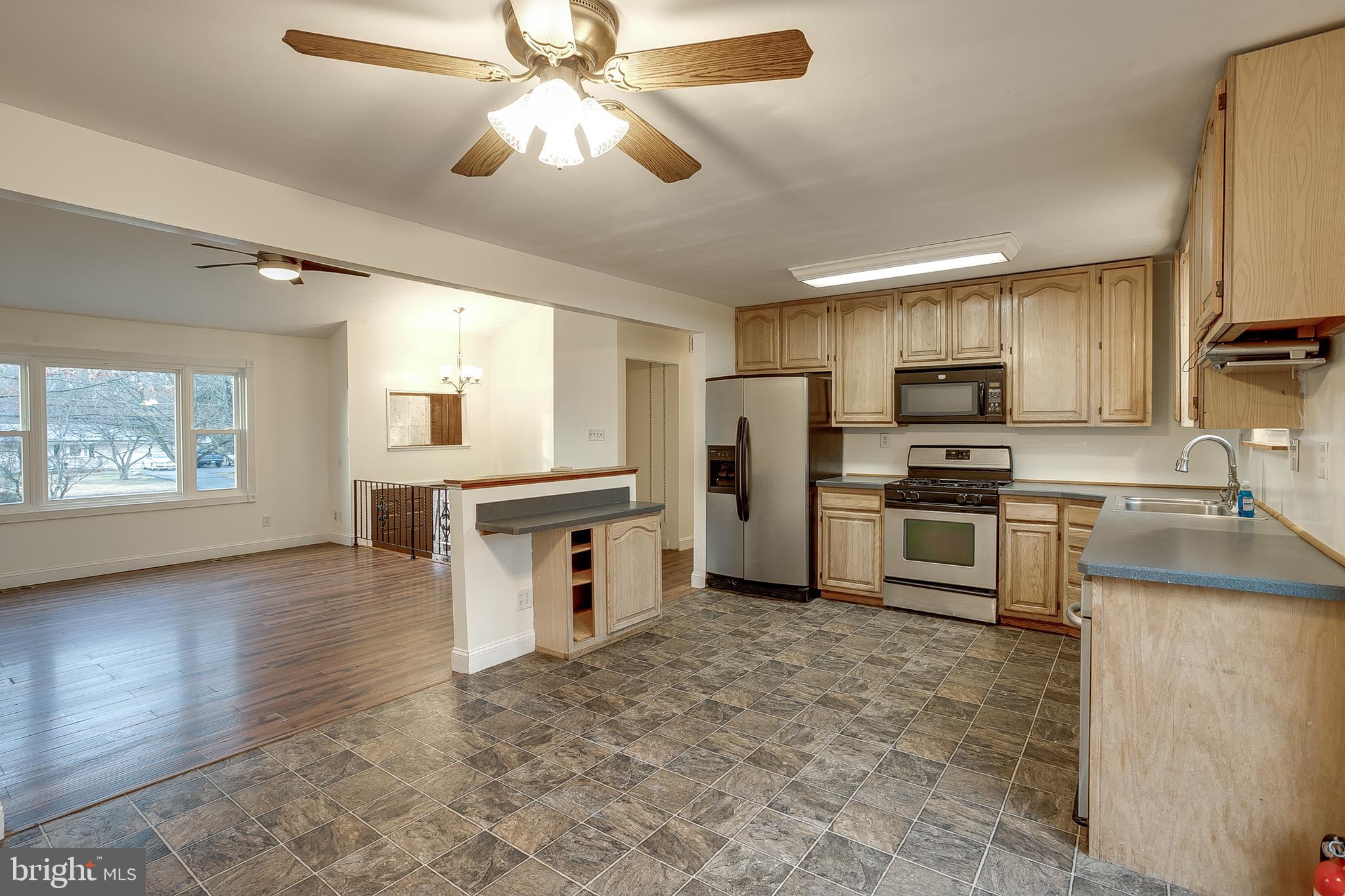 2430 Hopewell Road Berlin, NJ 08009 - Photo 8 of 30 a kitchen with refrigerator cabinets and a counter top space