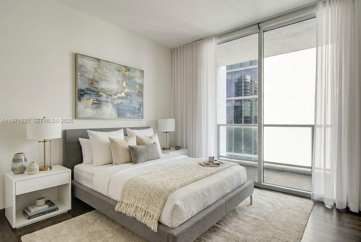 1050 Brickell Avenue, Unit 3406 Miami, FL 33131 - Photo 11 of 20 a bedroom with a bed and a window