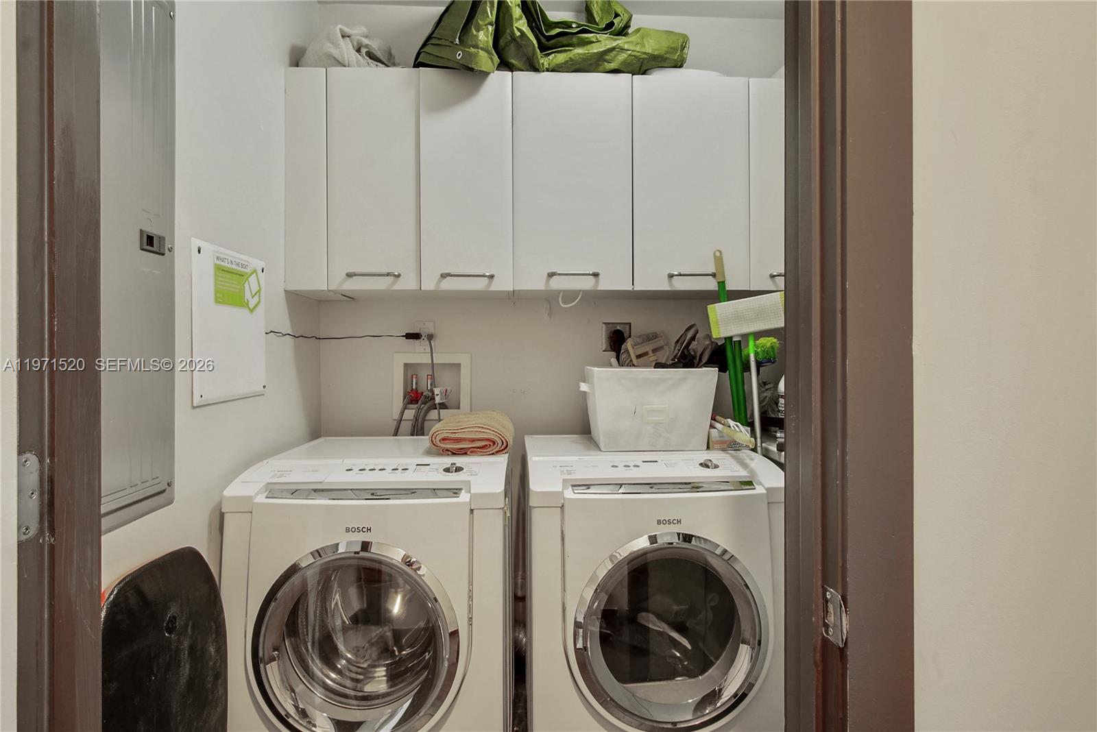 1050 Brickell Avenue, Unit 3406 Miami, FL 33131 - Photo 18 of 20 a utility room with dryer and washer