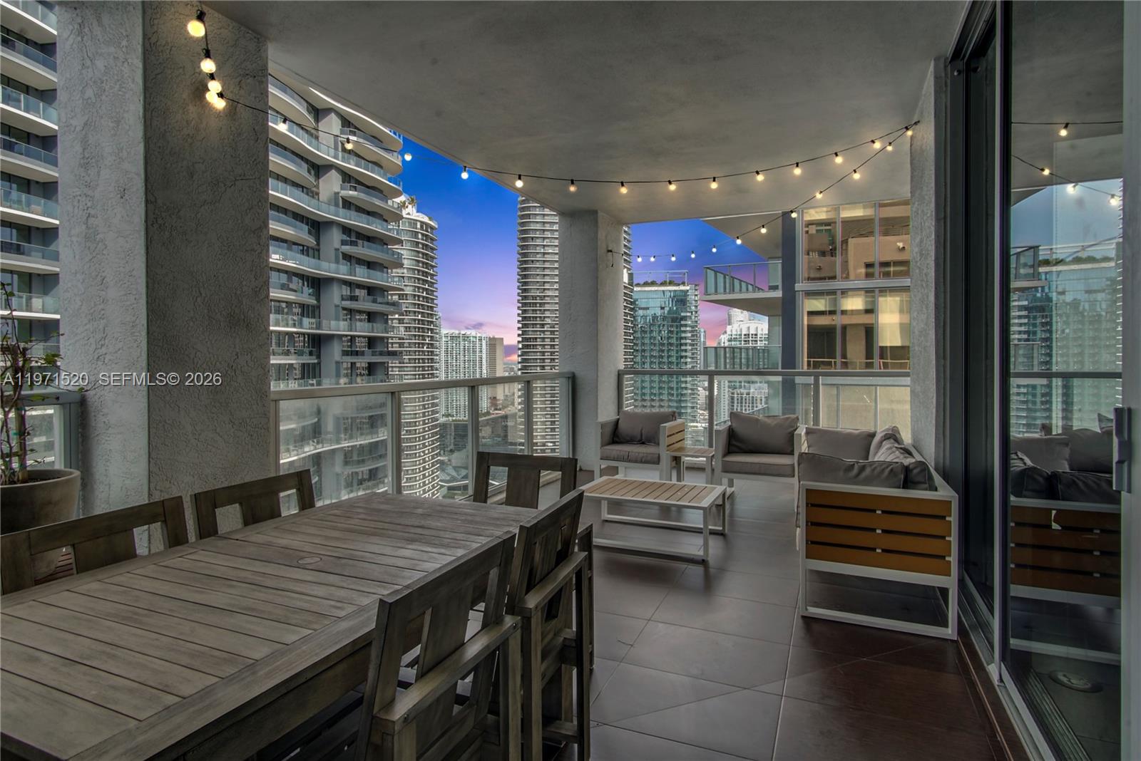 1050 Brickell Avenue, Unit 3406 Miami, FL 33131 - Photo 8 of 20 a dining room with furniture and wooden floor