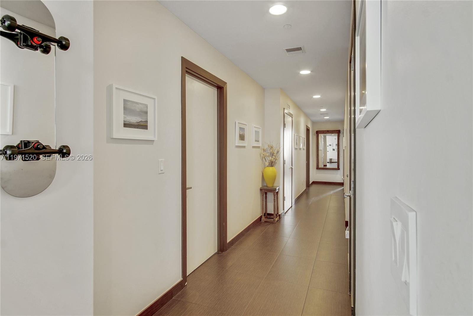 1050 Brickell Avenue, Unit 3406 Miami, FL 33131 - Photo 9 of 20 a view of a hallway with a living room