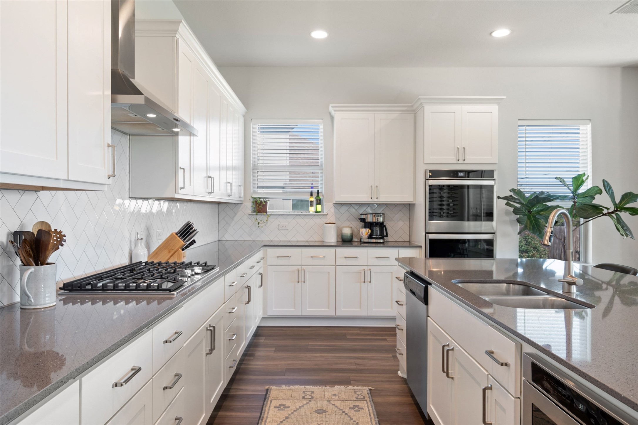 162 Lunar Loop Austin, TX 78737 - Photo 9 of 40 a kitchen with a sink stove and cabinets