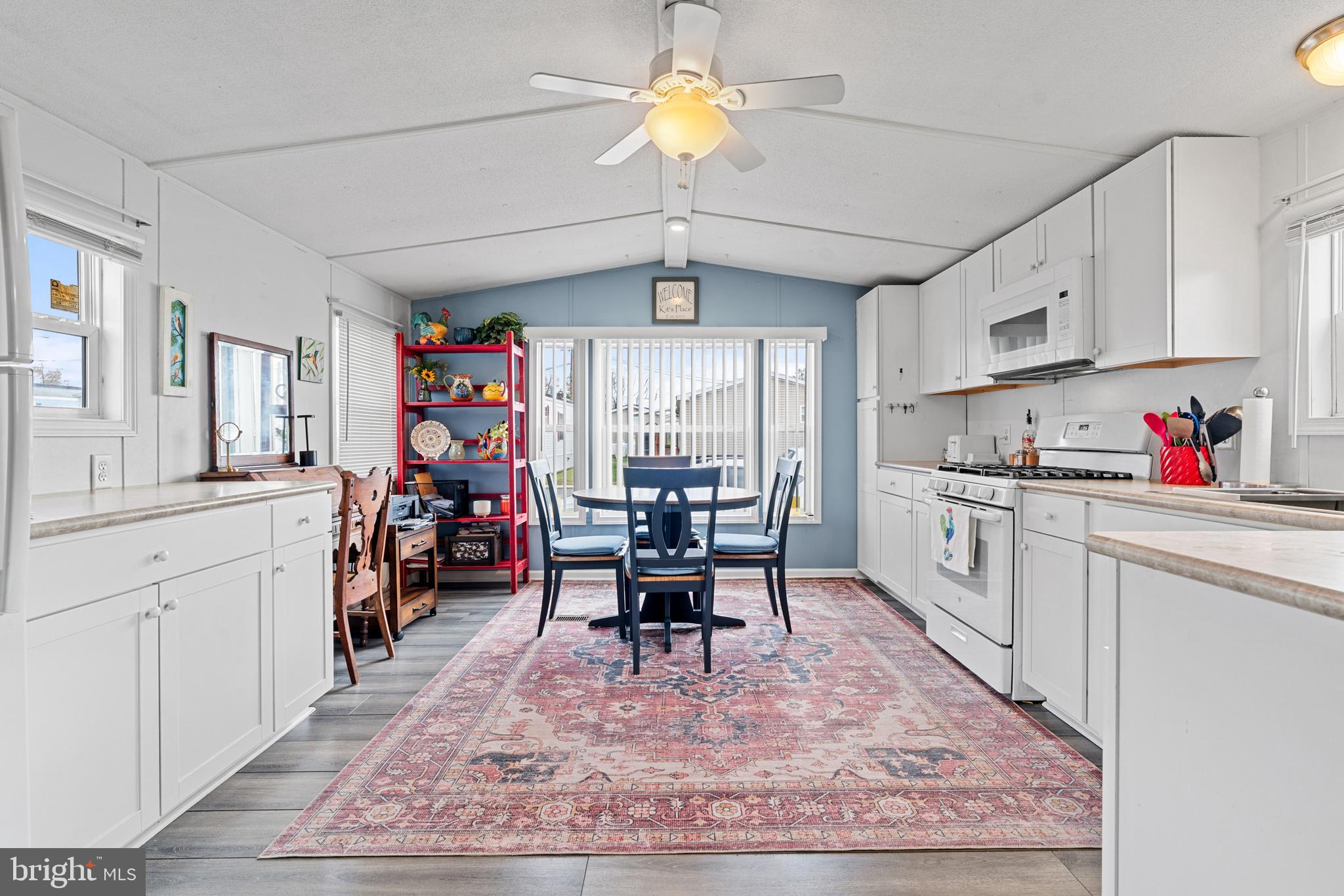 525 Canter Road Wilmington, DE 19810 - Photo 1 of 14 a kitchen with stainless steel appliances granite countertop a refrigerator a sink dishwasher a dining table and chairs with wooden floor
