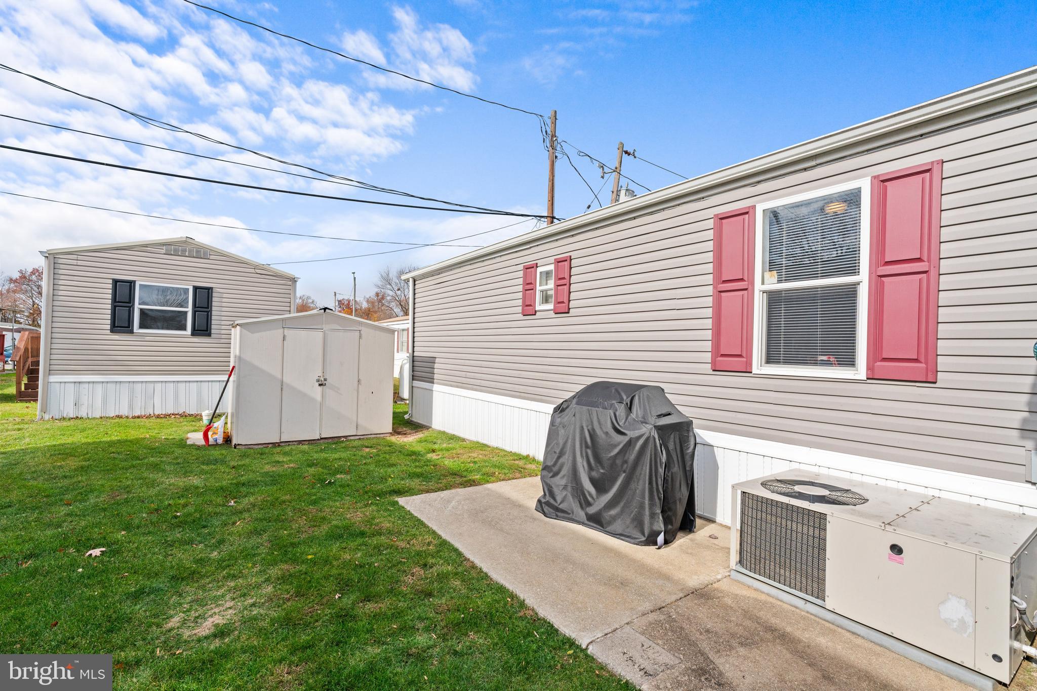 525 Canter Road Wilmington, DE 19810 - Photo 13 of 14 a view of a house with backyard and a chair