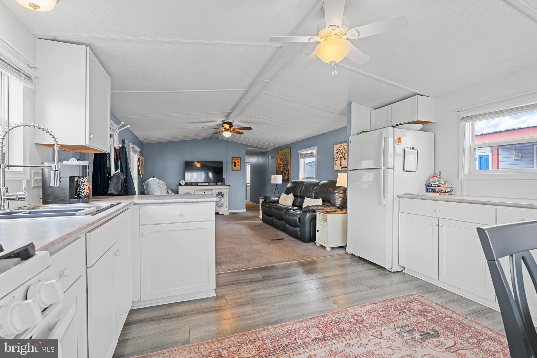 525 Canter Road Wilmington, DE 19810 - Photo 5 of 14 a kitchen with cabinets and wooden floor