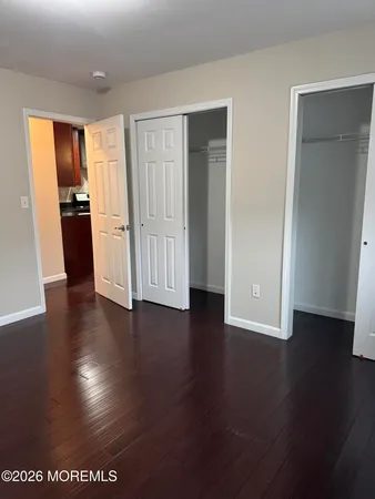 an empty room with wooden floor