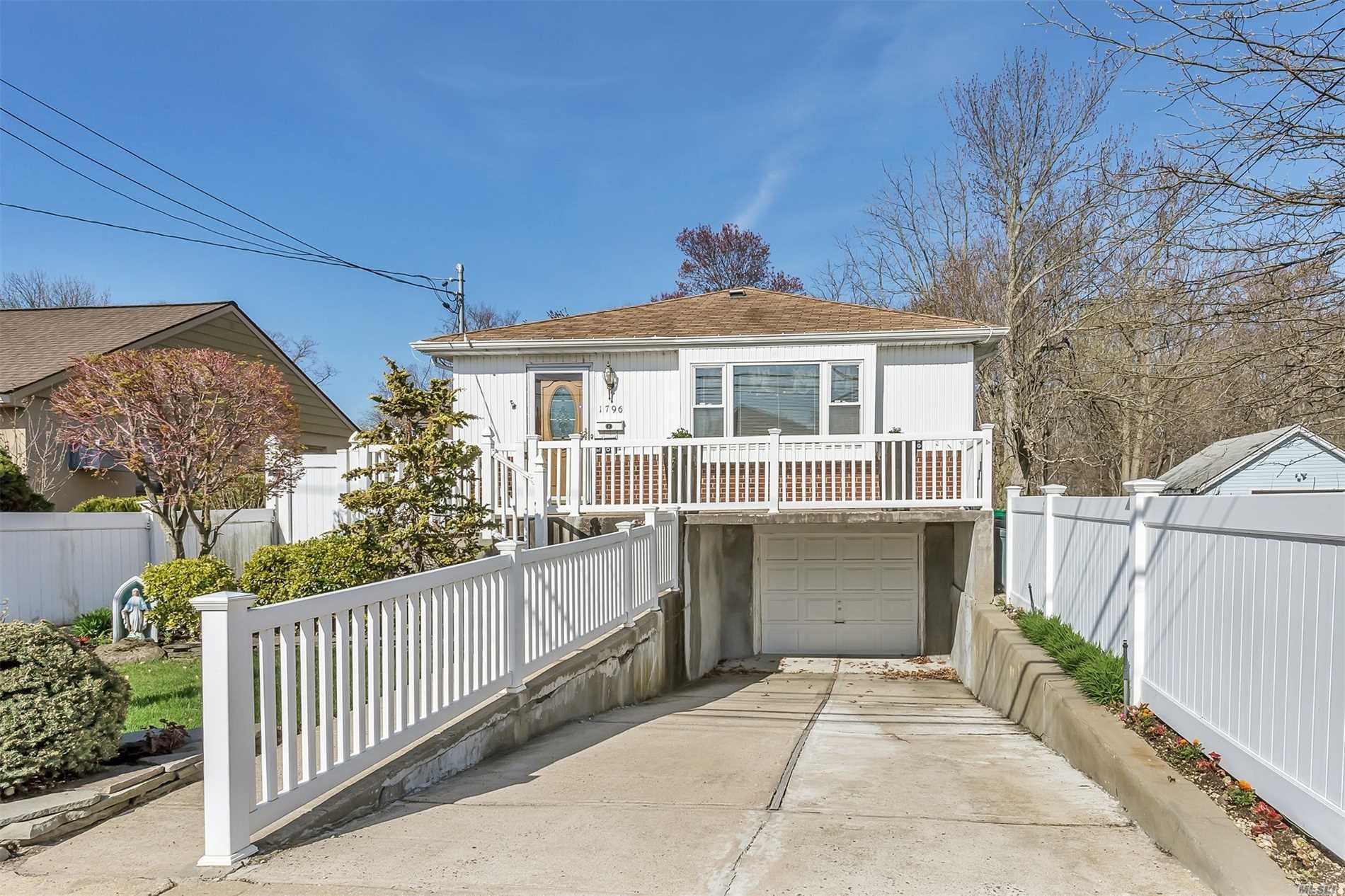 a front view of a house with a garage