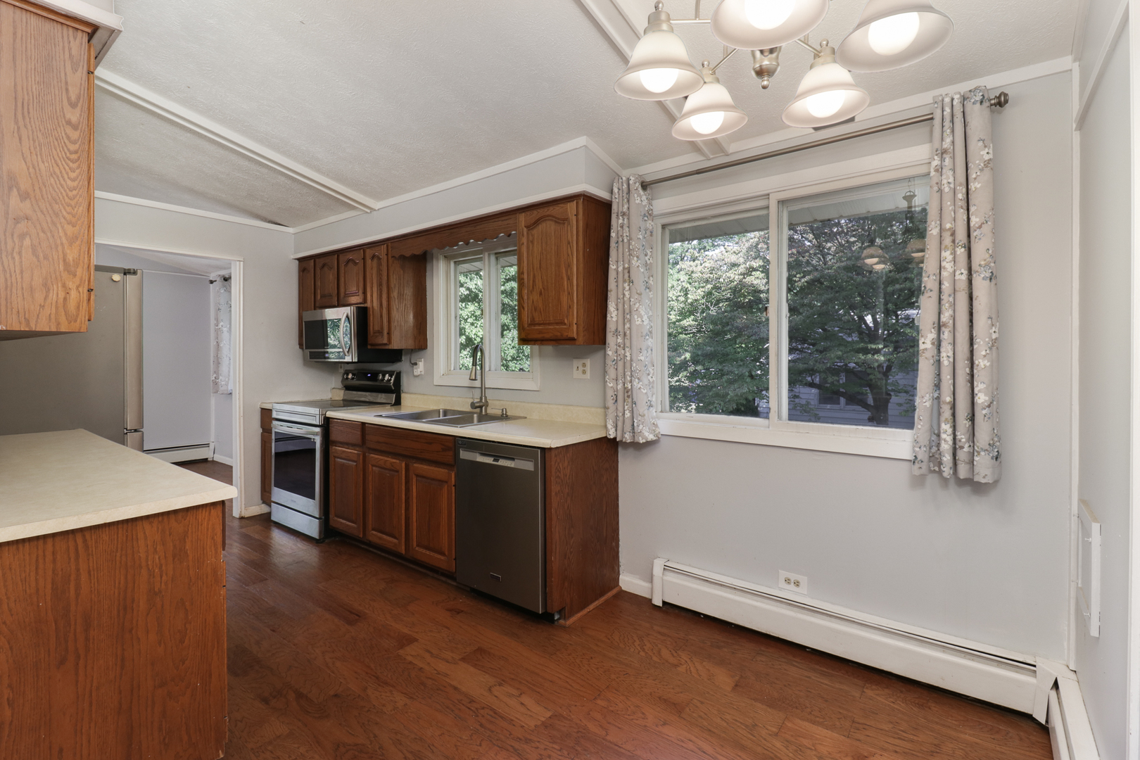 314 South Maple Avenue Minier, IL 61759 - Photo 11 of 30 a large kitchen with a large window a sink stainless steel appliances and cabinets
