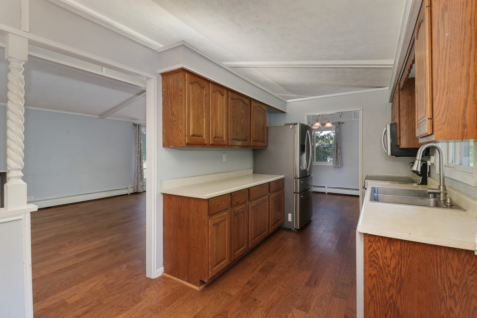 314 South Maple Avenue Minier, IL 61759 - Photo 12 of 30 a kitchen with stainless steel appliances granite countertop wooden cabinets a sink and a hard wood floor