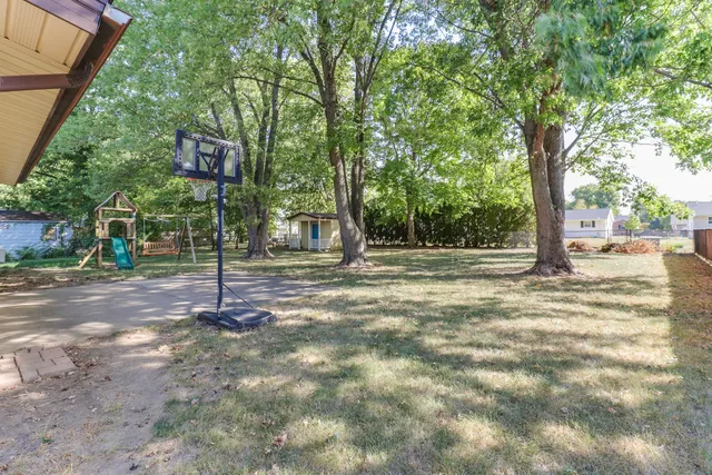 a backyard of a house with lots of green space
