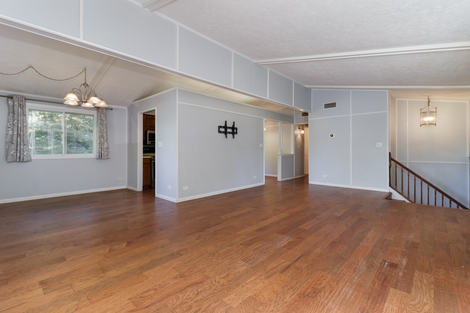 314 South Maple Avenue Minier, IL 61759 - Photo 6 of 30 a view of an empty room with wooden floor and a window