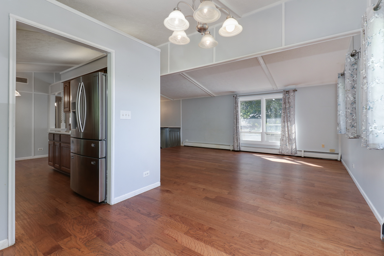 314 South Maple Avenue Minier, IL 61759 - Photo 8 of 30 a view of a livingroom with a ceiling fan window and wooden floor