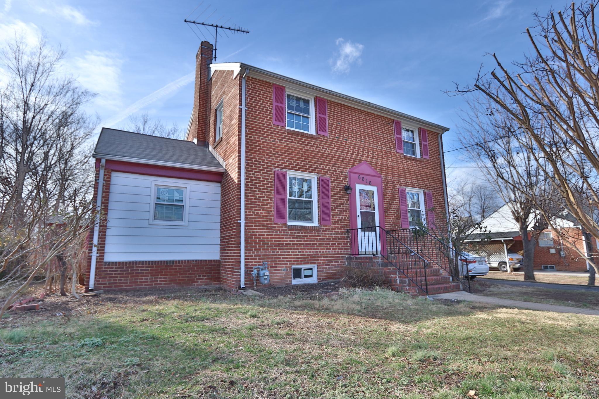 6016 Backlick Road Springfield, VA 22150 - Photo 2 of 24 a front view of a house with a yard