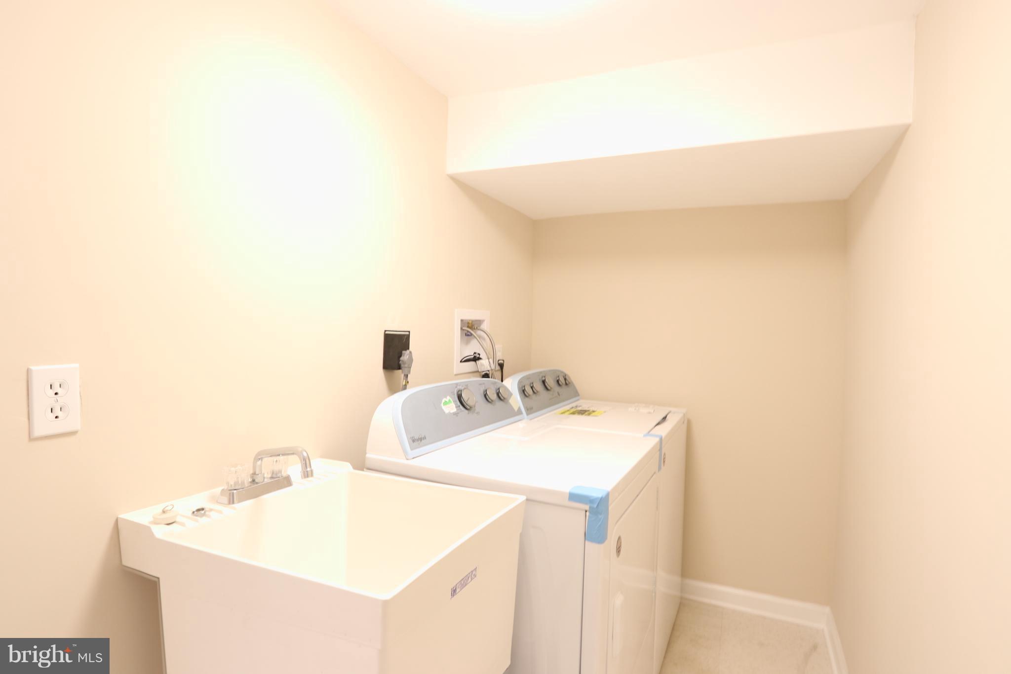 6016 Backlick Road Springfield, VA 22150 - Photo 20 of 24 a utility room with dryer and washer