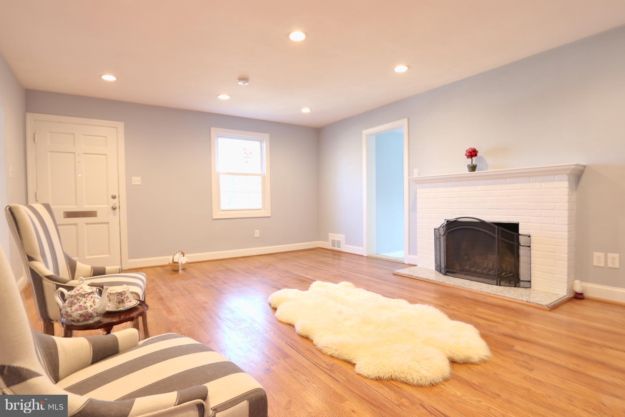 6016 Backlick Road Springfield, VA 22150 - Photo 6 of 24 a living room with furniture and a fireplace
