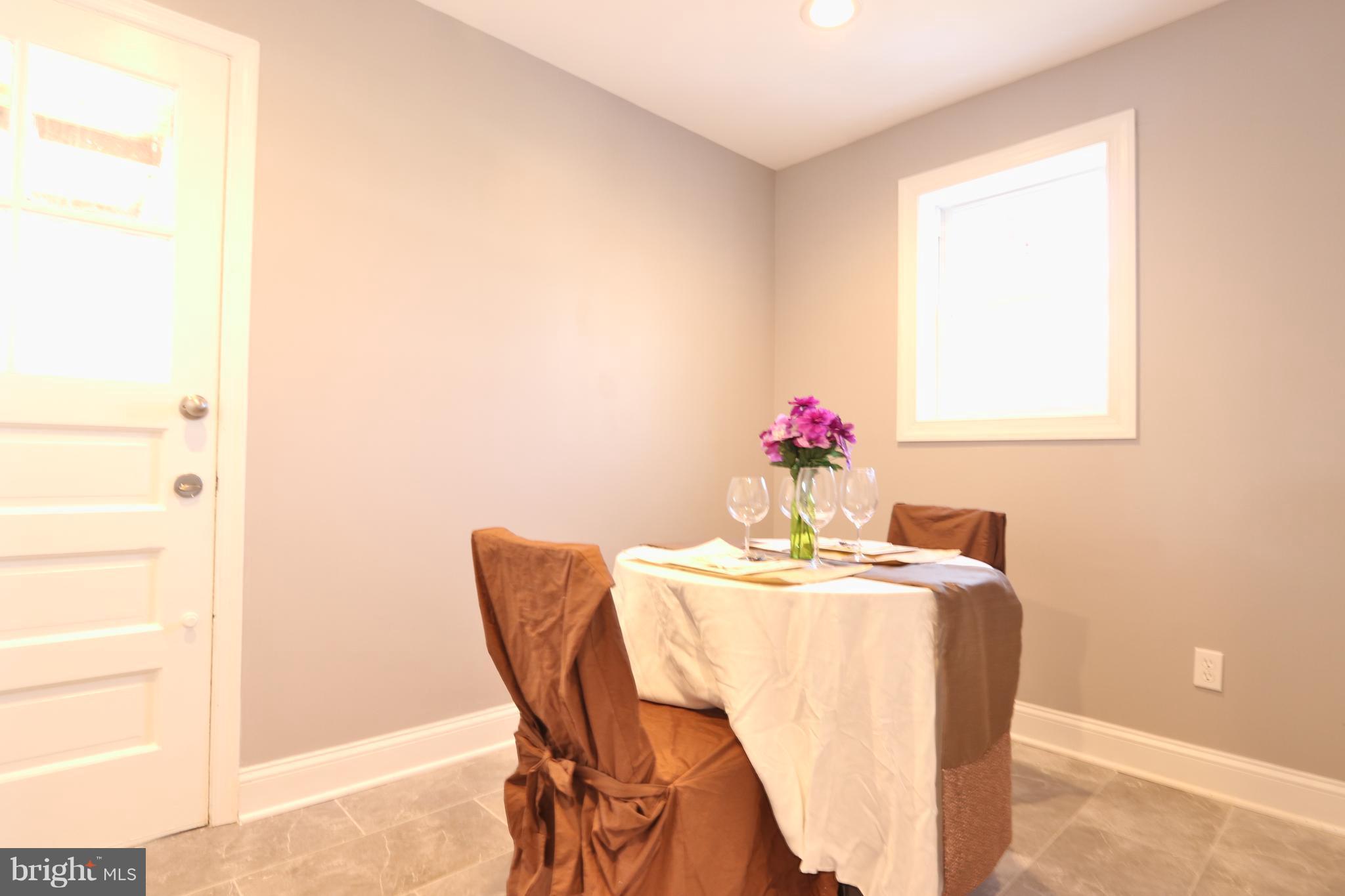6016 Backlick Road Springfield, VA 22150 - Photo 10 of 24 a dining room with furniture and wooden floor