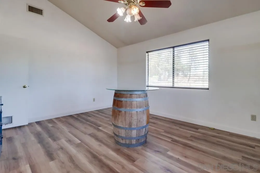 2920 Ribbonwood Road Boulevard, CA 91905 - Photo 15 of 65 wooden floor in an empty room with a window