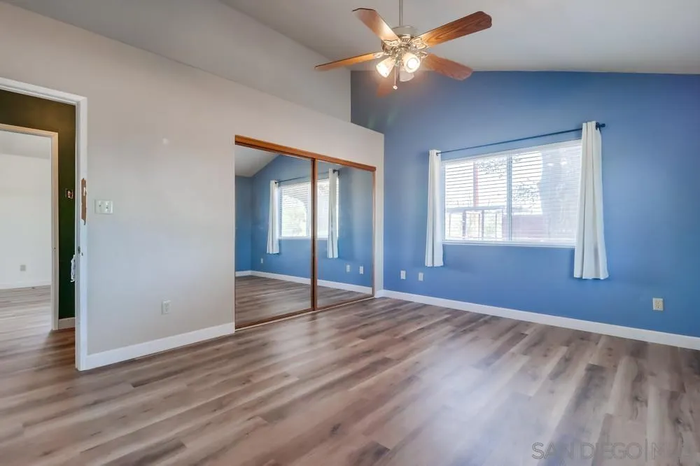 2920 Ribbonwood Road Boulevard, CA 91905 - Photo 17 of 65 a view of an empty room with window and wooden floor
