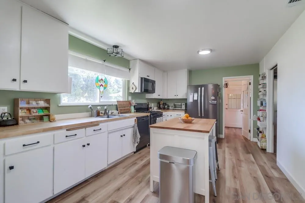 2920 Ribbonwood Road Boulevard, CA 91905 - Photo 19 of 65 a kitchen with white cabinets and refrigerator