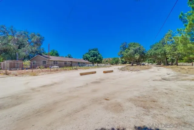 a house view with a backyard space
