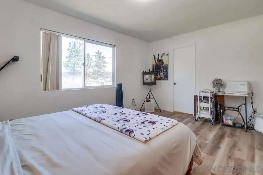 2920 Ribbonwood Road Boulevard, CA 91905 - Photo 26 of 65 a bedroom that has a bed and a table in it