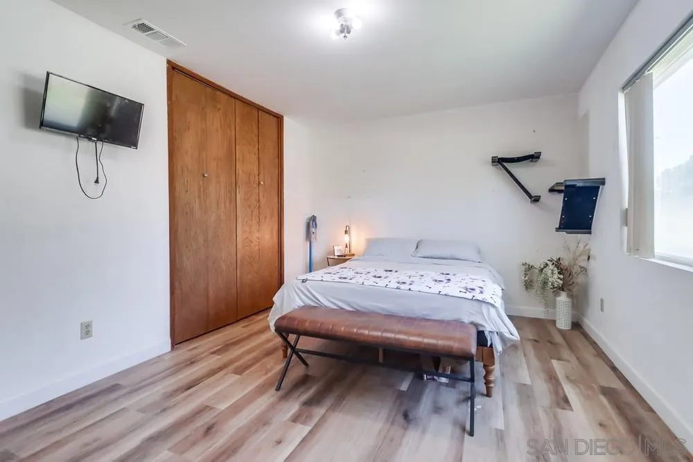 2920 Ribbonwood Road Boulevard, CA 91905 - Photo 27 of 65 a bedroom with a bed and a table in it