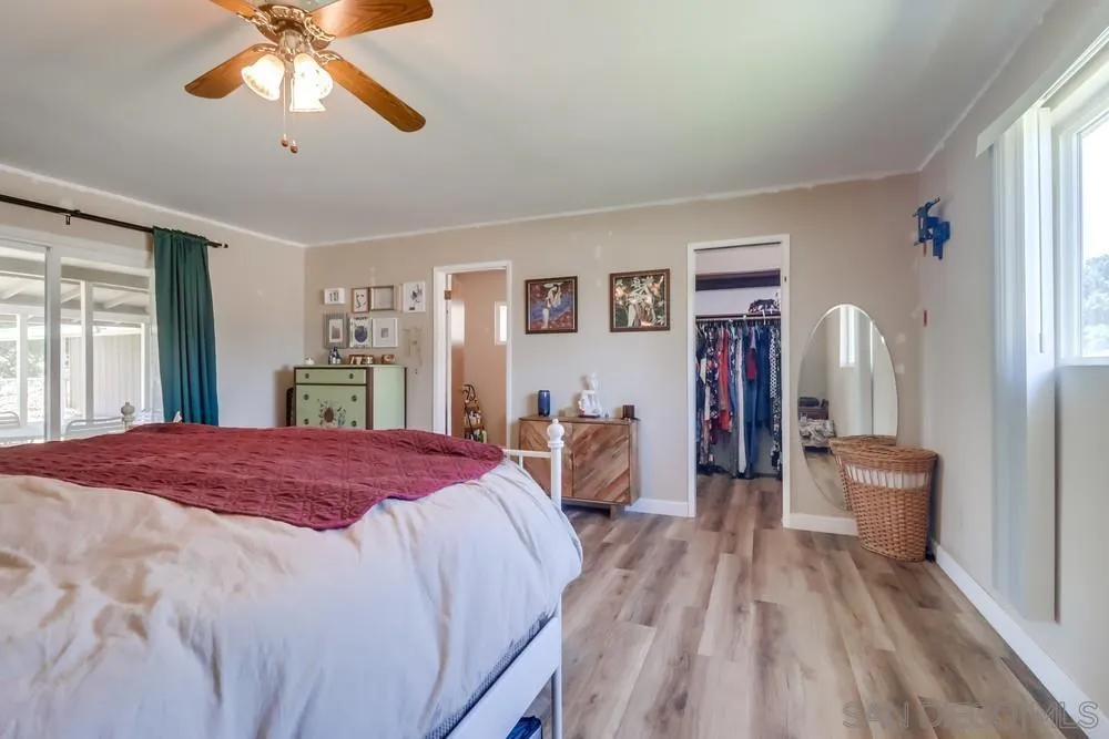 2920 Ribbonwood Road Boulevard, CA 91905 - Photo 31 of 65 a bed room with a bed and a chandelier