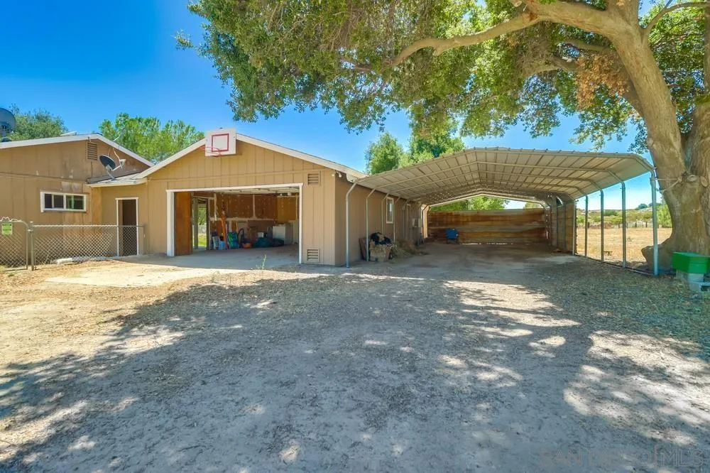 2920 Ribbonwood Road Boulevard, CA 91905 - Photo 37 of 65 a front view of a house with a yard and garage