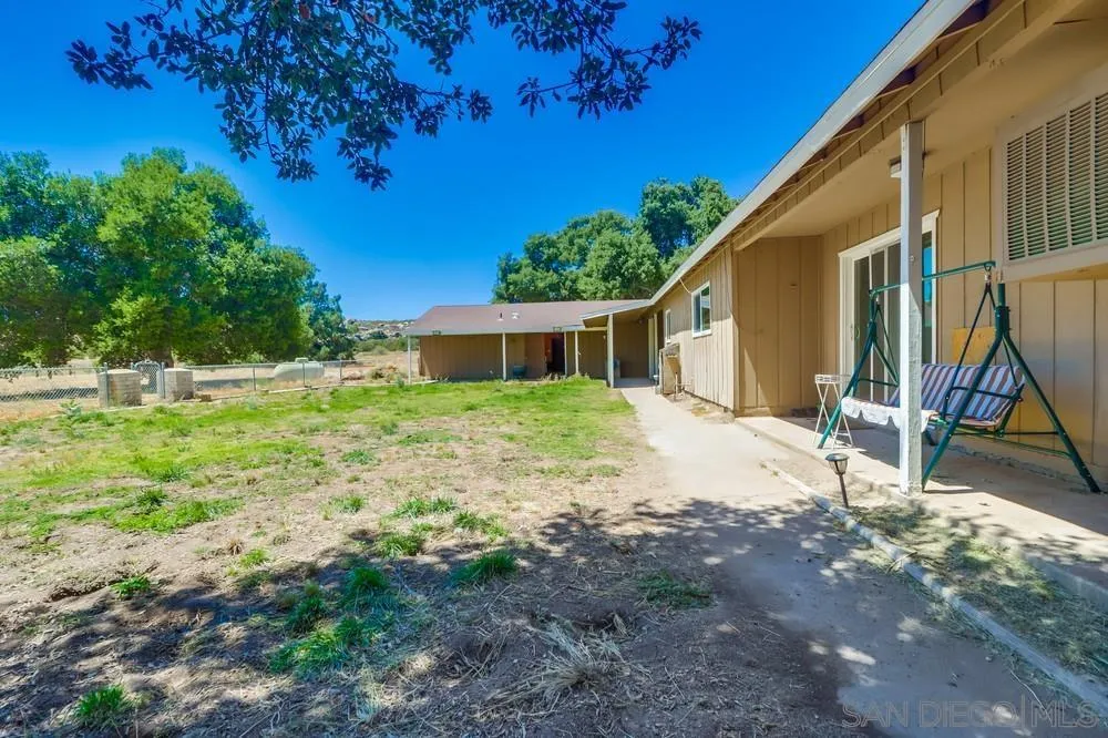 2920 Ribbonwood Road Boulevard, CA 91905 - Photo 49 of 65 a view of a house with backyard and wooden fence