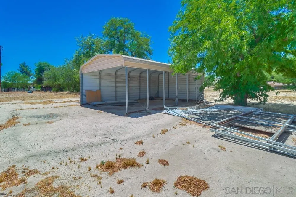 2920 Ribbonwood Road Boulevard, CA 91905 - Photo 65 of 65 a view of a barn house next to a yard with large trees