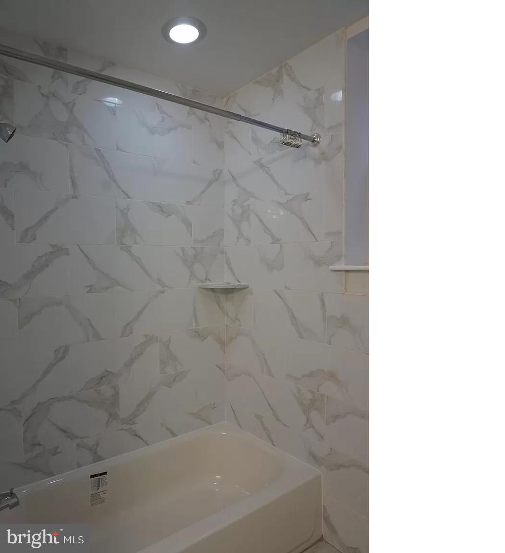 4945 Chestnut Street Philadelphia, PA 19139 - Photo 7 of 9 a bathroom with a bathtub