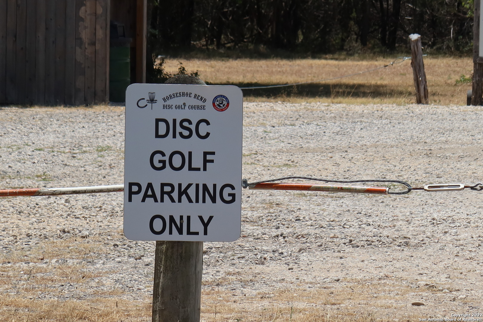 Tbd Cypress Bandera, TX 78003 - Photo 11 of 12 a street sign on a brick wall