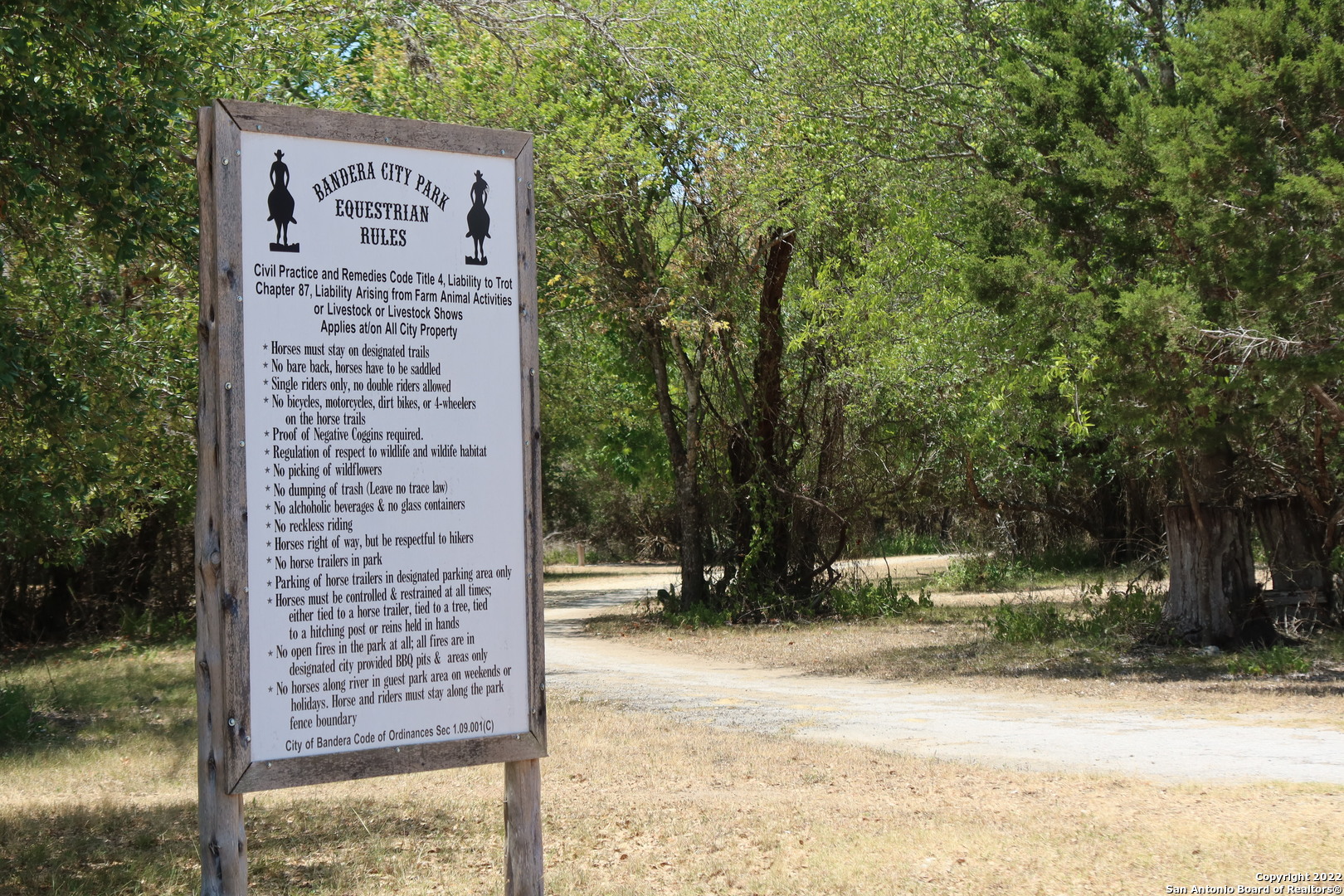 Tbd Cypress Bandera, TX 78003 - Photo 10 of 12 a sign board with a yard