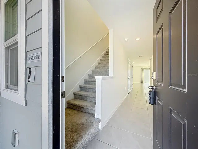 a view of a hallway with staircase