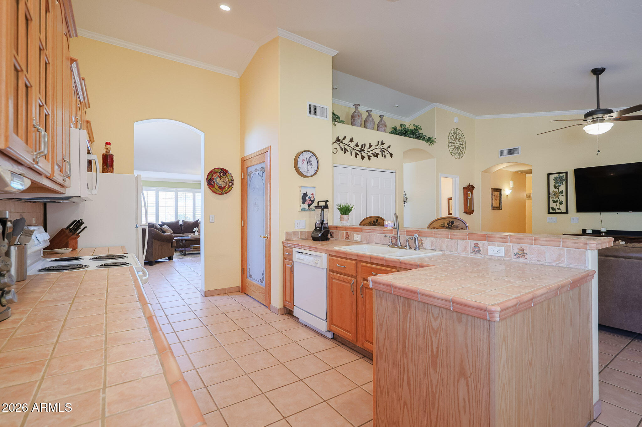 7344 North Alsup Road Litchfield Park, AZ 85340 - Photo 14 of 62 a large kitchen with a large counter top appliances and cabinets