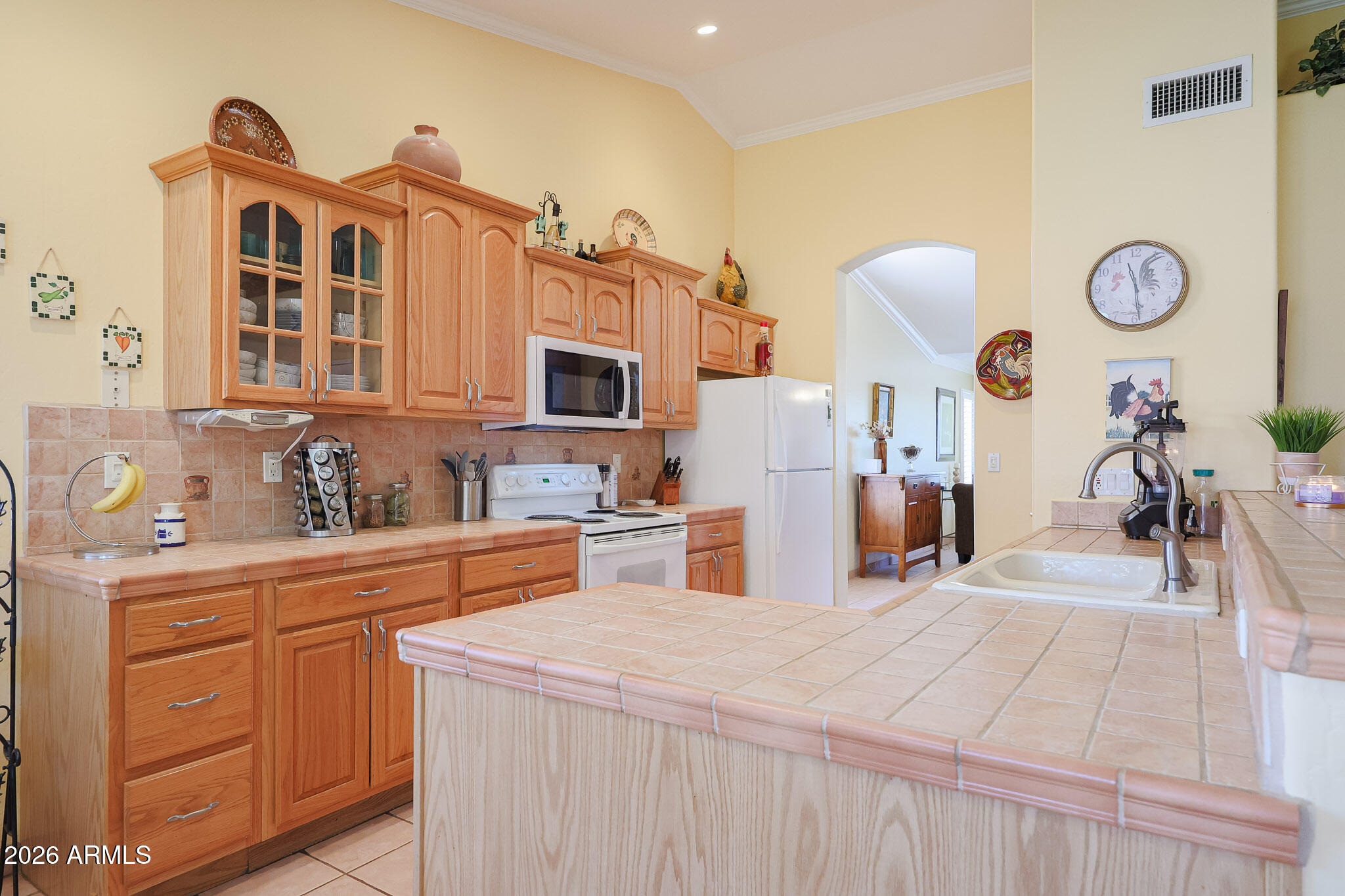 7344 North Alsup Road Litchfield Park, AZ 85340 - Photo 16 of 62 a kitchen with stainless steel appliances granite countertop a sink and cabinets