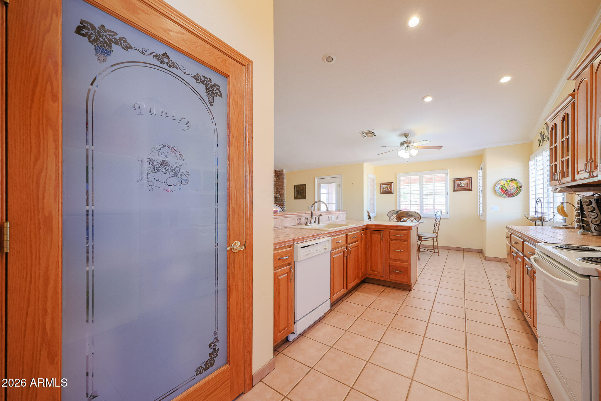 7344 North Alsup Road Litchfield Park, AZ 85340 - Photo 17 of 62 a large kitchen with a sink and stainless steel appliances