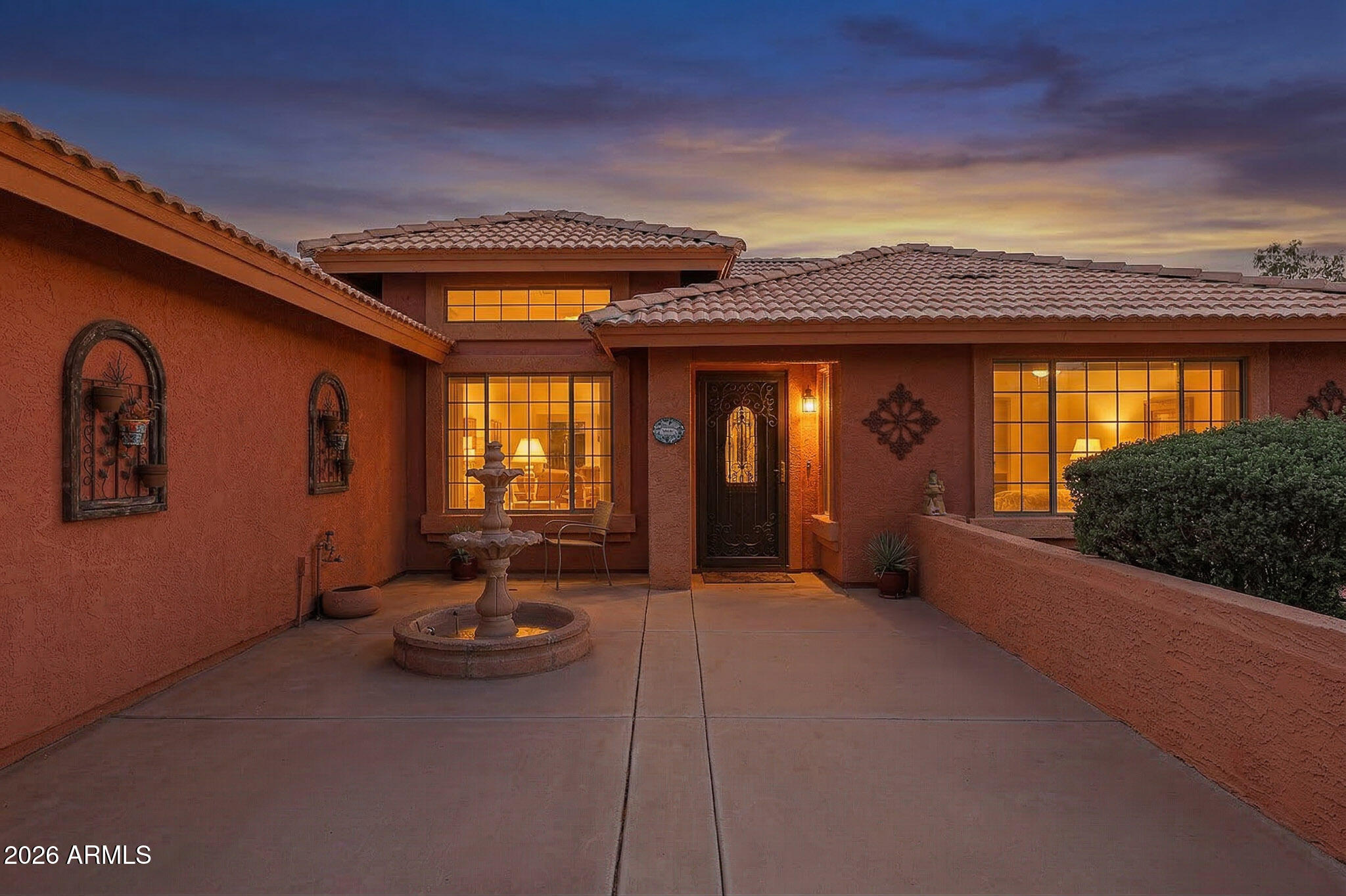 7344 North Alsup Road Litchfield Park, AZ 85340 - Photo 2 of 62 a view of a porch with a table and chairs
