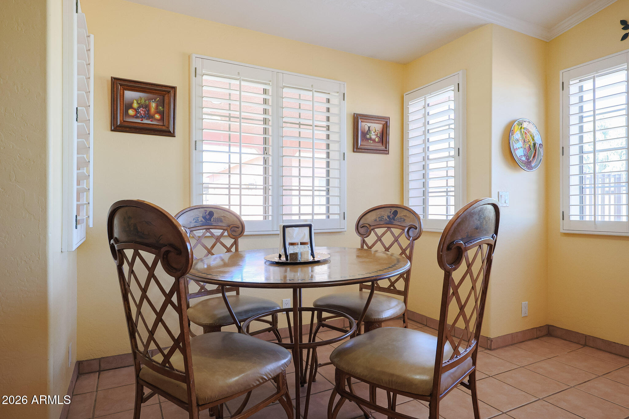 7344 North Alsup Road Litchfield Park, AZ 85340 - Photo 21 of 62 a view of a dining room that has a table and chairs in it