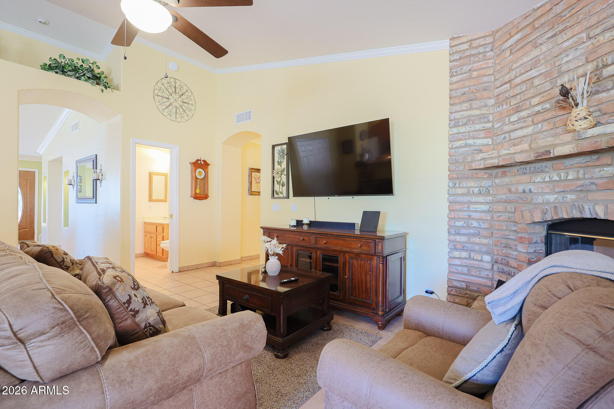 7344 North Alsup Road Litchfield Park, AZ 85340 - Photo 23 of 62 a living room with furniture and a flat screen tv