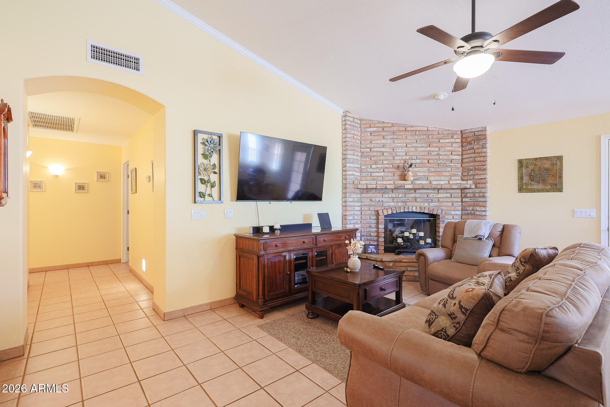7344 North Alsup Road Litchfield Park, AZ 85340 - Photo 24 of 62 a living room with furniture and a flat screen tv