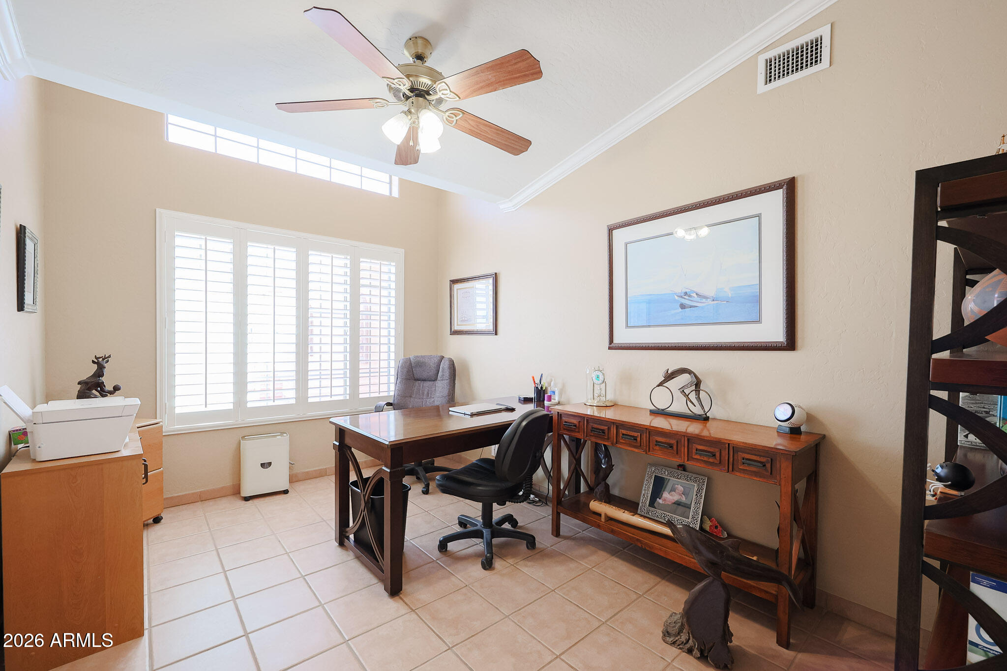 7344 North Alsup Road Litchfield Park, AZ 85340 - Photo 28 of 62 a view of a workspace with furniture and a window