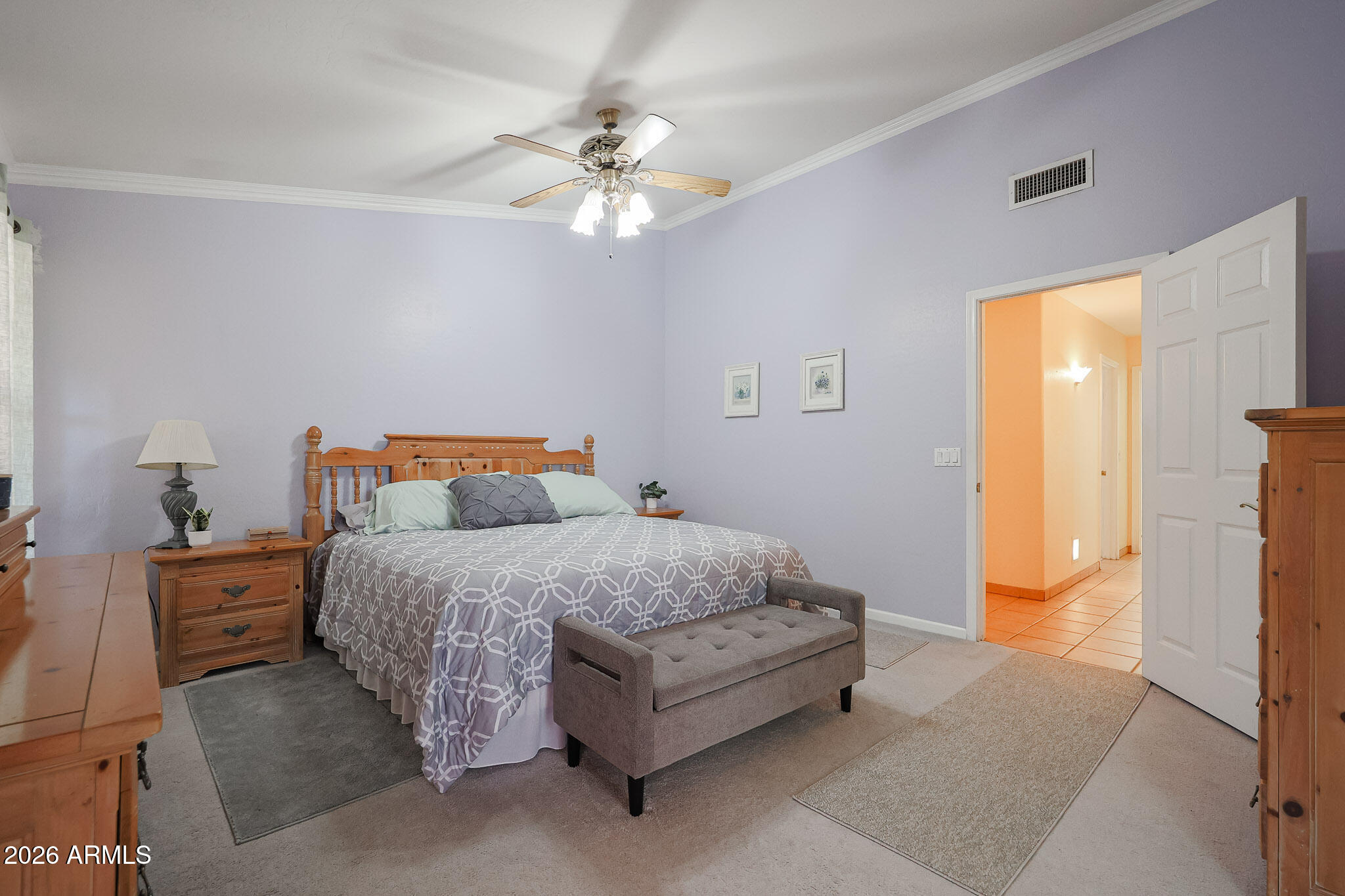 7344 North Alsup Road Litchfield Park, AZ 85340 - Photo 29 of 62 a spacious bedroom with a bed and a chandelier