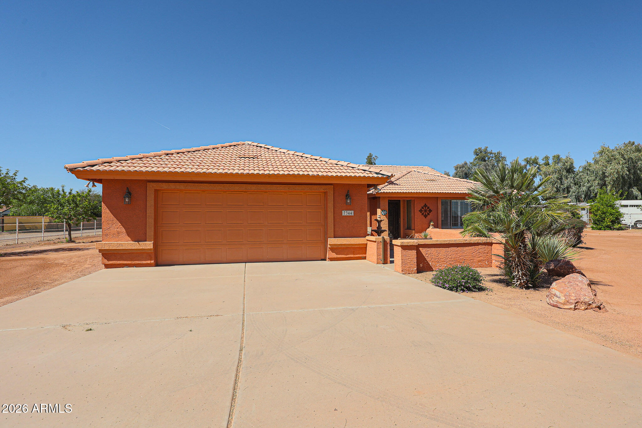 7344 North Alsup Road Litchfield Park, AZ 85340 - Photo 3 of 62 a front view of a house with a yard