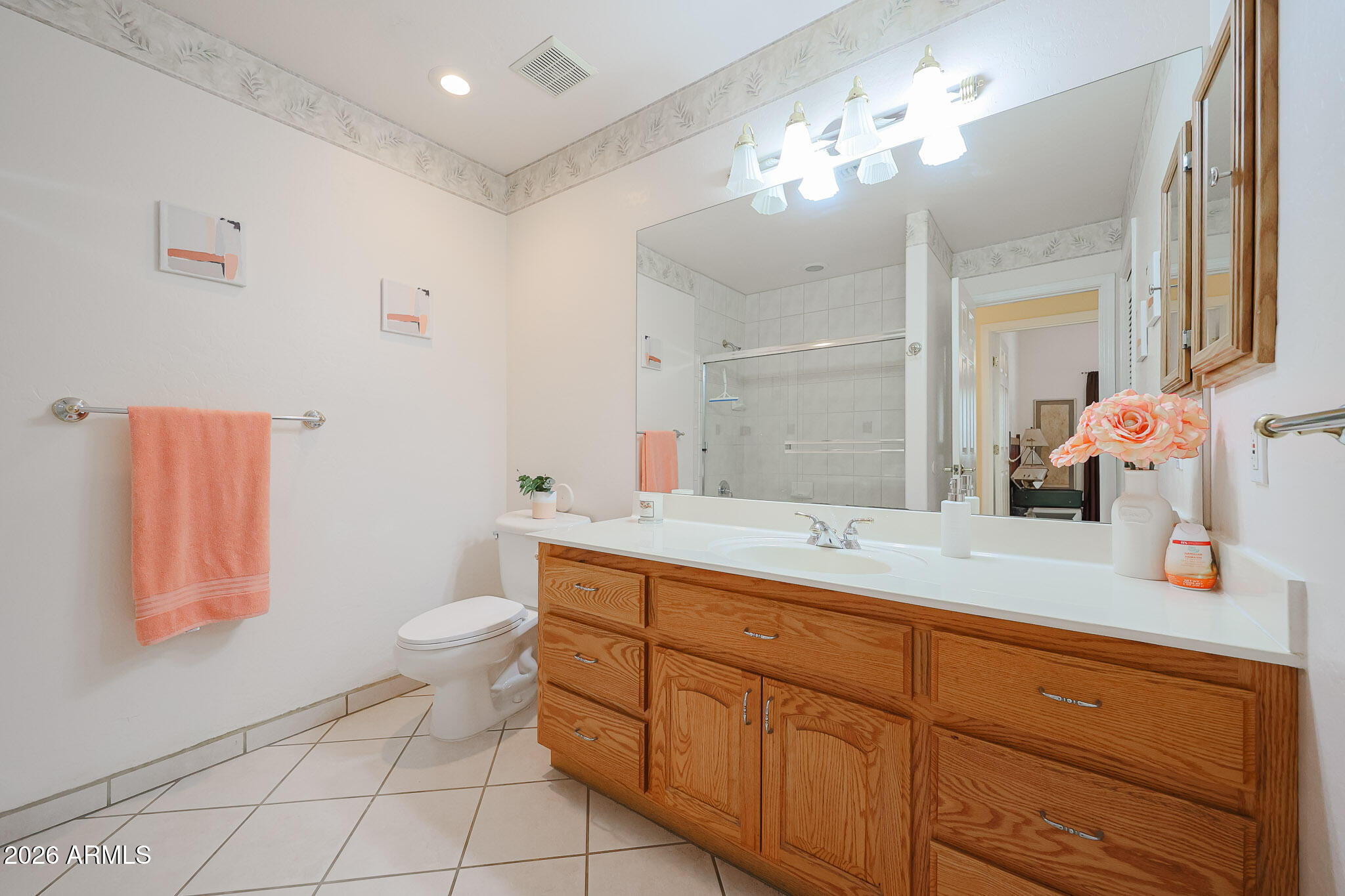 7344 North Alsup Road Litchfield Park, AZ 85340 - Photo 40 of 62 a bathroom with a toilet sink and mirror