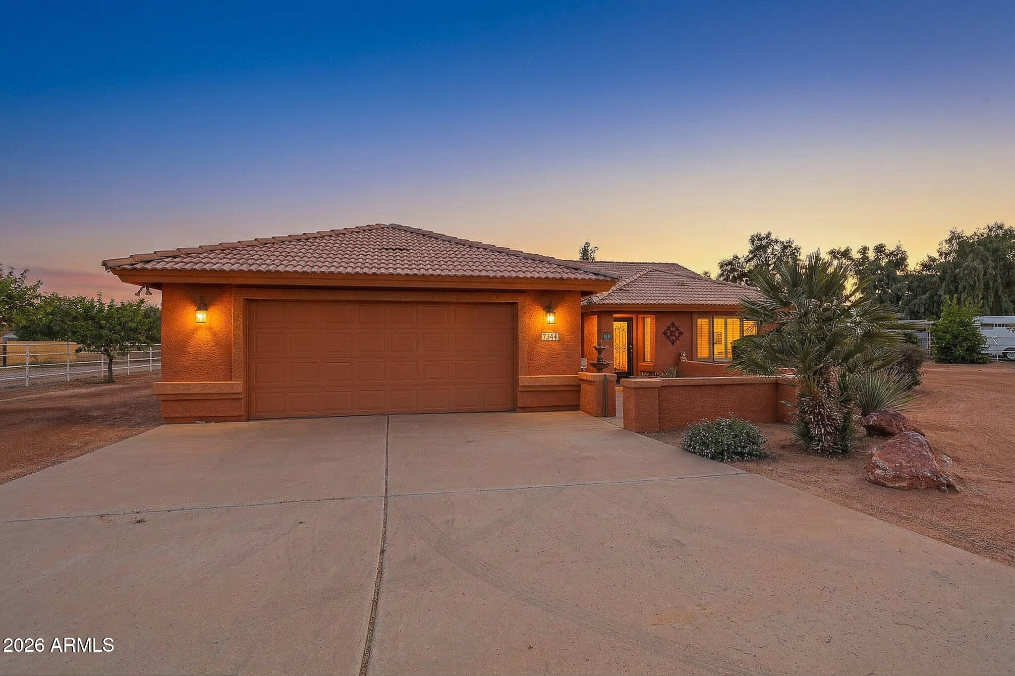 7344 North Alsup Road Litchfield Park, AZ 85340 - Photo 4 of 62 a front view of a house with a yard