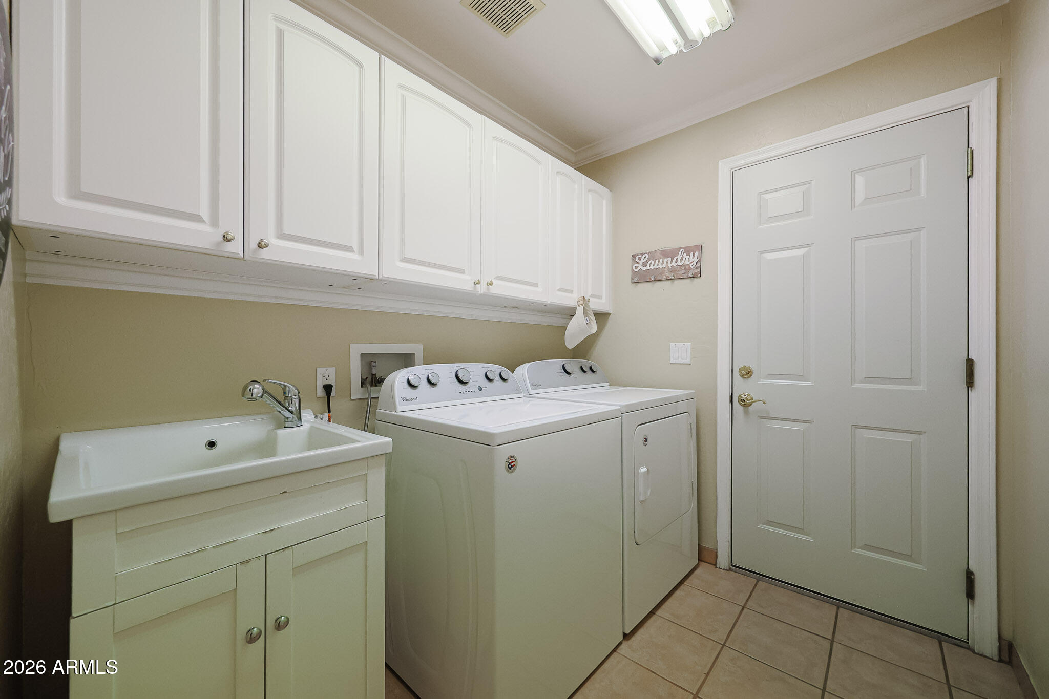 7344 North Alsup Road Litchfield Park, AZ 85340 - Photo 41 of 62 a utility room with dryer and washer
